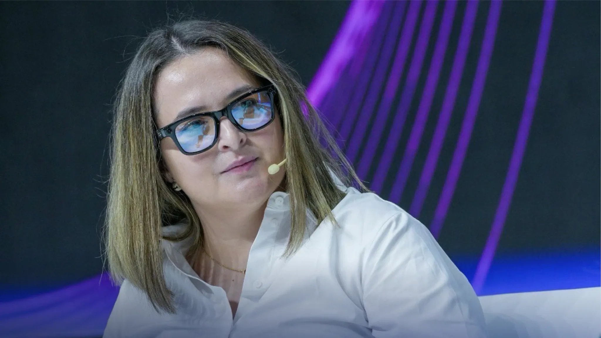 Dariia Vasylieva speaking on stage